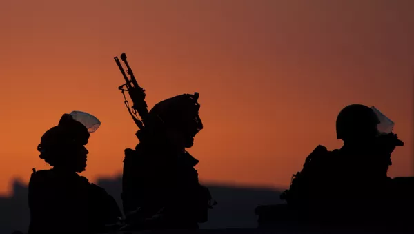 Israeli soldiers patrol during clashes with Palestinians a day after 14-year-old Palestinian-American, Orwah Hammad was killed by Israeli troops during clashes in the village of Silwad, near the West Bank city of Ramallah, Saturday, Oct. 25, 2014. - Sputnik Afrique
