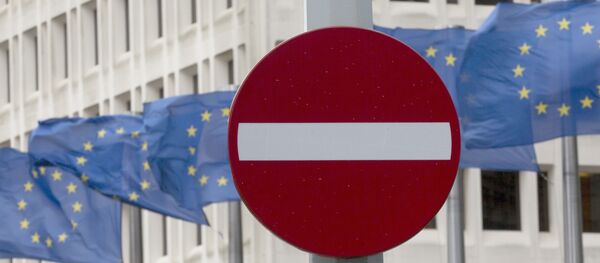 EU flags flap in the wind behind a no entry traffic sign in front of EU headquarters in Brussels. - Sputnik Afrique
