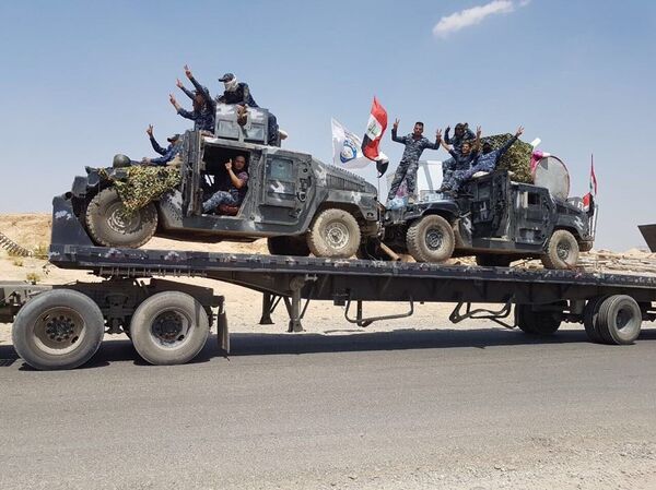 une colonne des forces de l'ordre partie en direction de Tel Afar une colonne des forces de l'ordre partie en direction de Tel Afar - Sputnik Afrique