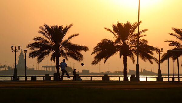 Man plays football at a corniche during sunset in Dammam, Saudi Arabia - Sputnik Afrique