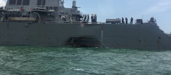 The U.S. Navy guided-missile destroyer USS John S. McCain is seen after a collision, in Singapore waters August 21, 2017. - Sputnik Afrique