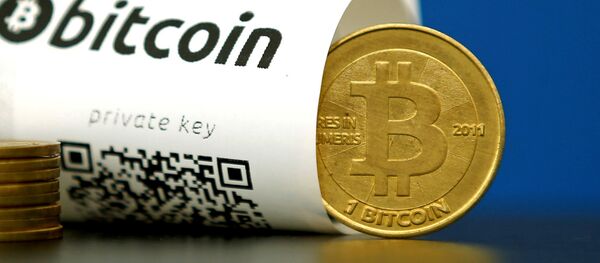 A Bitcoin (virtual currency) paper wallet with QR codes and a coin are seen in an illustration picture taken at La Maison du Bitcoin in Paris, France May 27, 2015 A Bitcoin (virtual currency) paper wallet with QR codes and a coin are seen in an illustration picture taken at La Maison du Bitcoin in Paris, France May 27, 2015 - Sputnik Afrique