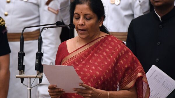 India's ruling BJP politician and member of parliament Nirmala Sitharaman takes the oath during the swearing-in ceremony of new ministers at the Presidential Palace in New Delhi - Sputnik Afrique