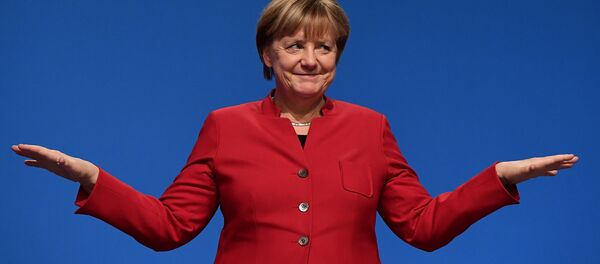 German Chancellor Angela Merkel gestures after addressing delegates during her conservative Christian Democratic Union (CDU) party's congress in Essen, western Germany, on December 6, 2016. - Sputnik Afrique