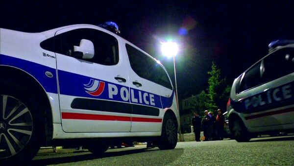 Police vehicles at the scene where a French police commander was stabbed to death in front of his home in the Paris suburb of Magnanville - Sputnik Afrique