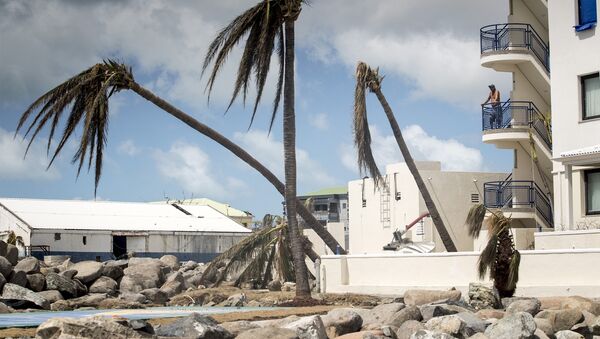 This photo provided by the Dutch Defense Ministry a resident surveys the damage done by the passing of Hurricane Irma, in Dutch Caribbean St. Maarten, on Sept. 8, 2017. - Sputnik Afrique