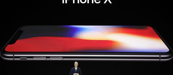 Apple CEO Tim Cook announces the new iPhone X at the Steve Jobs Theater on the new Apple campus, Tuesday, Sept. 12, 2017, in Cupertino, California. - Sputnik Afrique