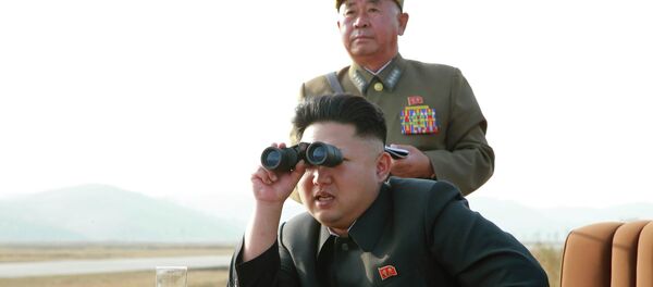 North Korean leader Kim Jong Un looks through a pair of binoculars as he guides a flight drill for the inspection of airmen of the Korean People's Army (KPA) - Sputnik Afrique
