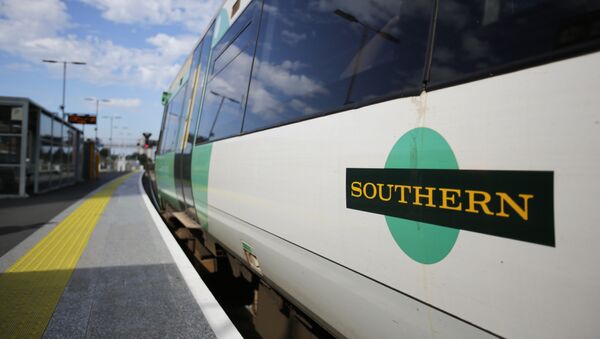 A Southern Rail logo is pictured on the side of a train carriage as t stands at a platform at East Croydon station, south of London - Sputnik Afrique