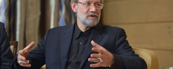 Speaker of the Islamic Consultative Council (parliament) of the Islamic Republic of Iran Ali Larijani during a meeting with Russian President Vladimir Putin following the 12th annual meeting of the Valdai International Discussion Club. File photo - Sputnik Afrique