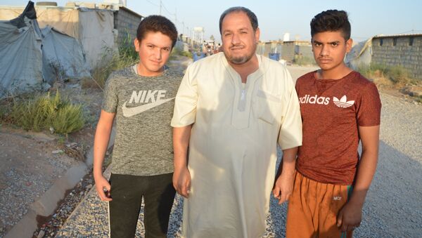 Une famille dans le camp de réfugiés à Erbil - Sputnik Afrique