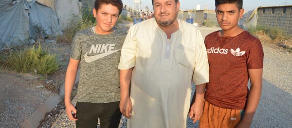 Une famille dans le camp de réfugiés à Erbil - Sputnik Afrique