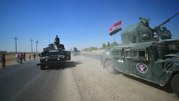 Members of Iraqi federal forces gather to continue to advance in military vehicles in Kirkuk, Iraq - Sputnik Afrique