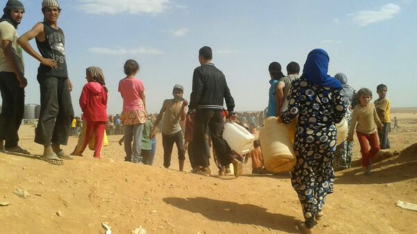 Les réfugiés syriens dans le camp d'el-Rukban - Sputnik Afrique