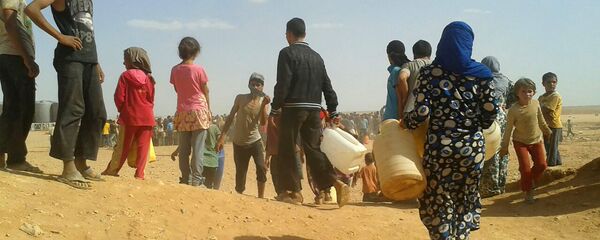 Les réfugiés syriens dans le camp d'Al-Rukban - Sputnik Afrique