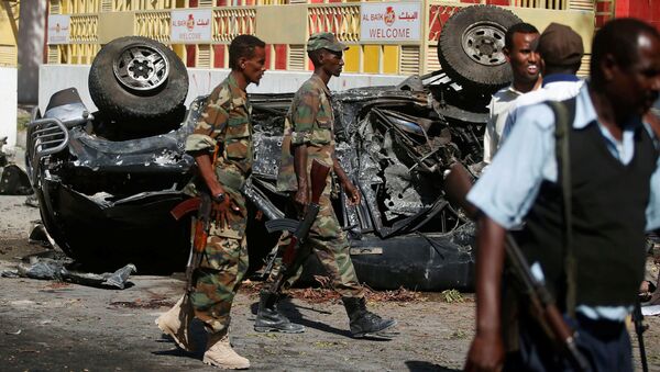 Вооруженные силы Сомали на месте атаки ресторана боевиками Аш-Шабааб в Могадишо - Sputnik Afrique