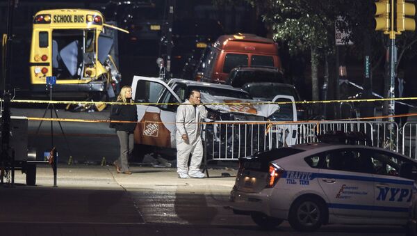 Police work near a damaged Home Depot truck after a motorist drove onto a bike path near the World Trade Center memorial, striking and killing several people, Wednesday, Nov. 1, 2017, in New York. - Sputnik Afrique