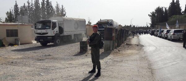 Des militaires russes assurent la sécurité de la livraison de l'aide humanitaire - Sputnik Afrique