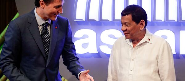 Le Premier ministre canadien Justin Trudeau et le Président philippin Rodrigo Duterte - Sputnik Afrique