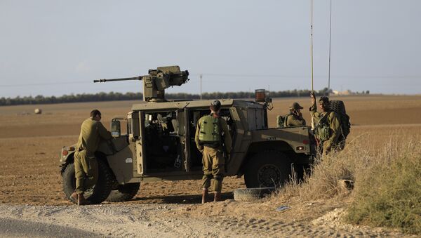 Israeli soldiers stand near the border with Gaza. (File) - Sputnik Afrique