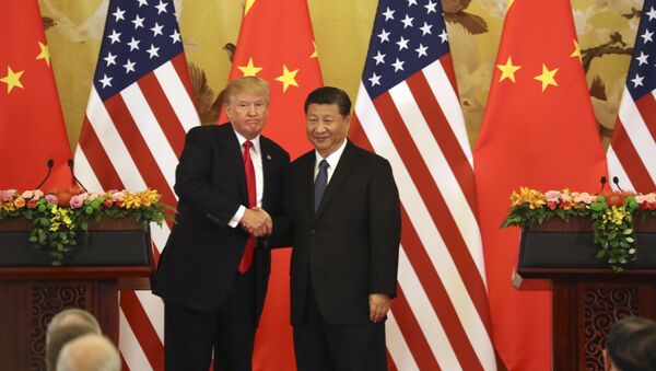 U.S. President Donald Trump and Chinese President Xi Jinping shakes hands during a joint press conference at the Great Hall of the People, Thursday, Nov. 9, 2017, in Beijing. - Sputnik Afrique