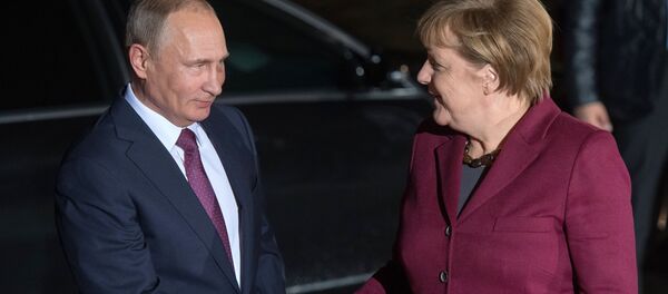 Vladimir Putin und Angela Merkel - Sputnik Afrique