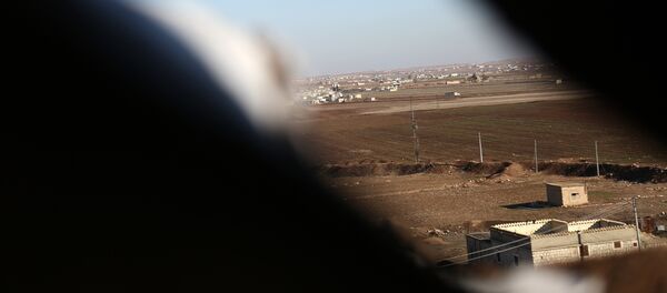 A picture taken from a tent belonging to Turkish-backed fighters from the Free Syrian Army in the Tal Malid area, north of Aleppo, as they target Kurdish People's Protection Units (YPG) positions in the area of Afrin, on January 20, 2018. - Sputnik Afrique