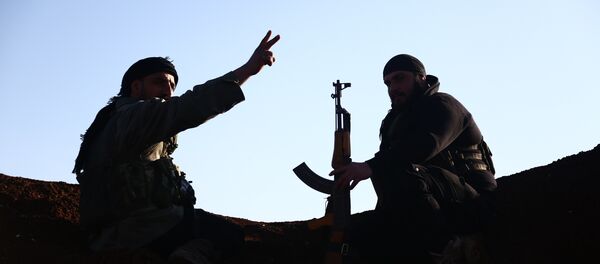 Turkish-backed fighters from the Free Syrian Army hold a position in the Tal Malid area, north of Aleppo, as they prepare to target Kurdish People's Protection Units (YPG) positions in the area of Afrin, on January 20, 2018. - Sputnik Afrique