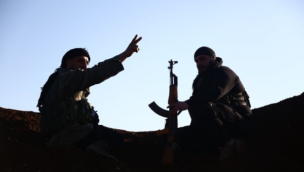 Turkish-backed fighters from the Free Syrian Army hold a position in the Tal Malid area, north of Aleppo, as they prepare to target Kurdish People's Protection Units (YPG) positions in the area of Afrin, on January 20, 2018. - Sputnik Afrique