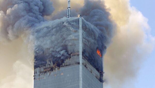 Fire and smoke billows from the north tower of New York's World Trade Center after terrorists crashed two hijacked airliners into the World Trade Center and brought down the twin 110-story towers. (File) - Sputnik Afrique
