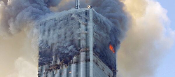 Fire and smoke billows from the north tower of New York's World Trade Center after terrorists crashed two hijacked airliners into the World Trade Center and brought down the twin 110-story towers. (File) - Sputnik Afrique