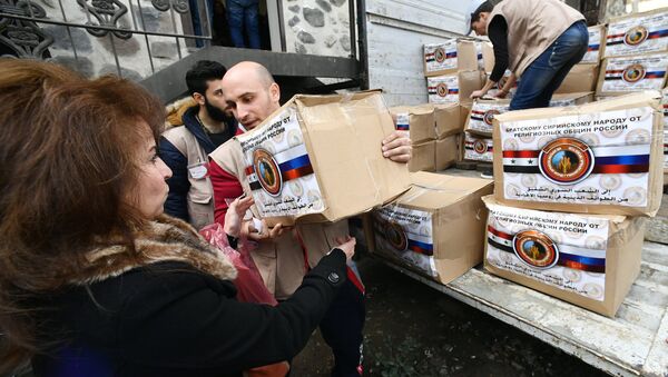 Distribution d'aide humanitaire envoyée par les croyants russes à Damas - Sputnik Afrique