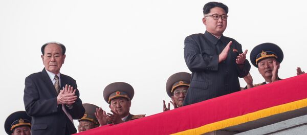 (FILES) This file photo taken on May 10, 2016 shows North Korean leader Kim Jong-Un (2nd R), followed by President of the Presidium of the Supreme People's Assembly Kim Yong-Nam (2nd L), walking on a balcony of the Grand People's Study House after watching a military parade and mass rally on Kim Il-Sung square in Pyongyang. - Sputnik Afrique