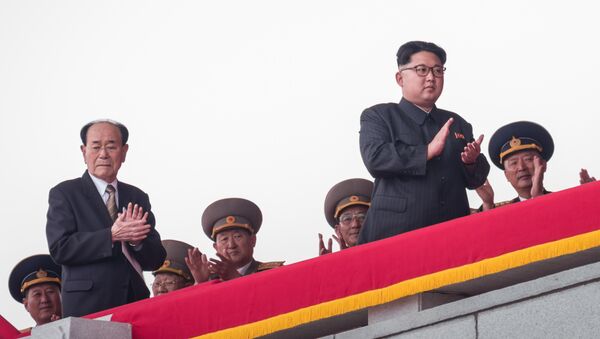 (FILES) This file photo taken on May 10, 2016 shows North Korean leader Kim Jong-Un (2nd R), followed by President of the Presidium of the Supreme People's Assembly Kim Yong-Nam (2nd L), walking on a balcony of the Grand People's Study House after watching a military parade and mass rally on Kim Il-Sung square in Pyongyang. - Sputnik Afrique
