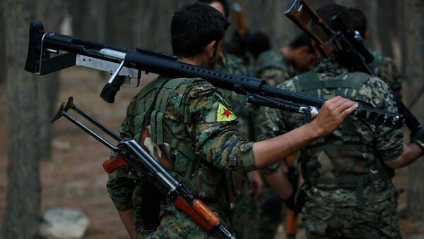 Des membres des Unités kurdes de protection du peuple  - Sputnik Afrique