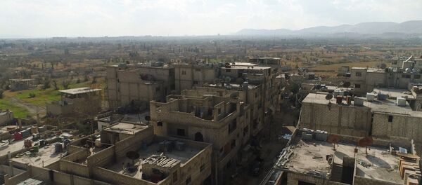 A humanitarian corridor between Damascus and East Ghouta near the Al Wafidin refugee camp in Syria A humanitarian corridor between Damascus and East Ghouta near the Al Wafidin refugee camp in Syria - Sputnik Afrique