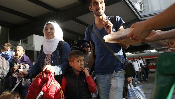 Des réfugiés syriens à la gare de Munich - Sputnik Afrique