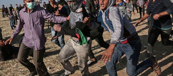 Protestataires palestiniens à la frontière entre Israel et Gaza - Sputnik Afrique