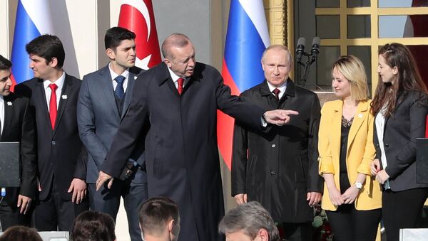 Turkish President Tayyip Erdogan (3rdL) and his Russian counterpart Vladimir Putin (3rdR) attend a symbolic ground-breaking ceremony for Turkey's first nuclear power station at the Presidential Palace in Ankara on April 3, 2018 - Sputnik Afrique