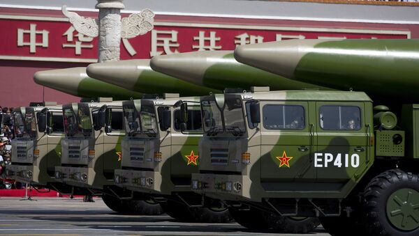 Military vehicles carrying DF-26 ballistic missiles drive past Tiananmen Gate during a military parade at Tiananmen Square in Beijing on September 3, 2015, to mark the 70th anniversary of victory over Japan and the end of World War II - Sputnik Afrique