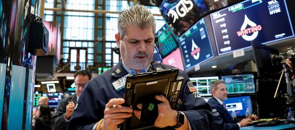 The Dow Jones Industrial average is displayed on a screen after the closing bell at the New York Stock Exchange, (NYSE) in New York, U.S., April 10, 2018. - Sputnik Afrique