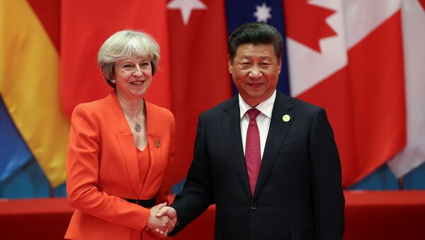 Xi Jinping et Theresa May - Sputnik Afrique