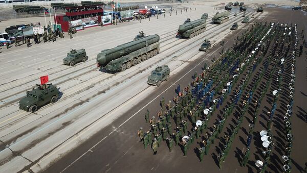 Tigr armored vehicles with Arbalet remote controlled weapon stations and RS-24 Yars transporter-launcher containers during a Victory Day Military Parade rehearsal at the Alabino military training ground in the Moscow Region - Sputnik Afrique