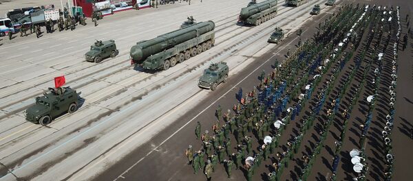 Tigr armored vehicles with Arbalet remote controlled weapon stations and RS-24 Yars transporter-launcher containers during a Victory Day Military Parade rehearsal at the Alabino military training ground in the Moscow Region - Sputnik Afrique