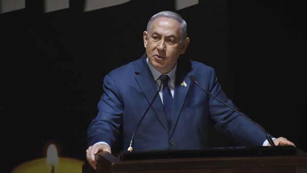 Israeli Prime Minister Benjamin Netanyahu speaks at the official ceremony for Israel's Memorial Day for fallen soldiers, at the National Memorial Hall for Israel's Fallen, in Mt. Herzl Military Cemetery, Jerusalem, Wednesday, April 18, 2018. - Sputnik Afrique