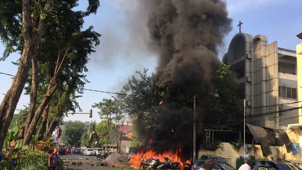 Motorcycles burn following a blast at the Pentecost Church Central Surabaya (GPPS), in Surabaya, East Java, Indonesia May 13, 2018, in this photo provided by Antara Foto. - Sputnik Afrique