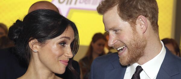 Britain's Prince Harry, left and Meghan Markle attend a women's empowerment reception at the Royal Aeronautical Society, during the Commonwealth Heads of Government Meeting, in London, Thursday April 19, 2018. - Sputnik Afrique