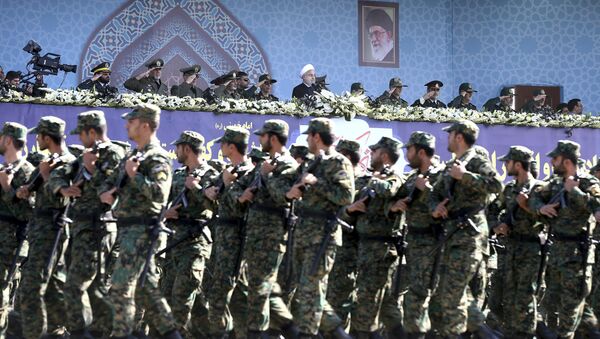 Iran's President Hassan Rouhani, top center, reviews army troops marching during the 37th anniversary of Iraq's 1980 invasion of Iran, in front of the shrine of the late revolutionary founder, Ayatollah Khomeini, just outside Tehran, Iran, Friday, Sept. 22, 2017 - Sputnik Afrique