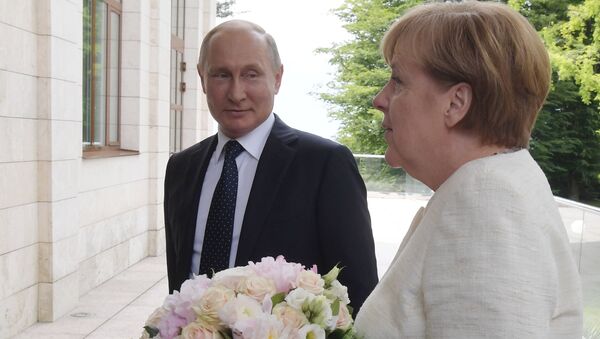 Le président Vladimir Poutine a rencontré la chancelière allemande Angela Merkel - Sputnik Afrique