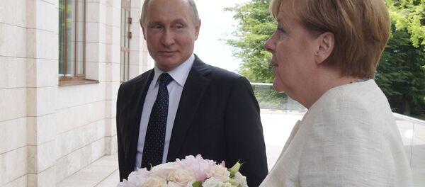 Le président Vladimir Poutine a rencontré la chancelière allemande Angela Merkel - Sputnik Afrique